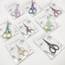 Portable folding scissors with sheath