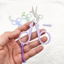 Portable folding scissors with sheath