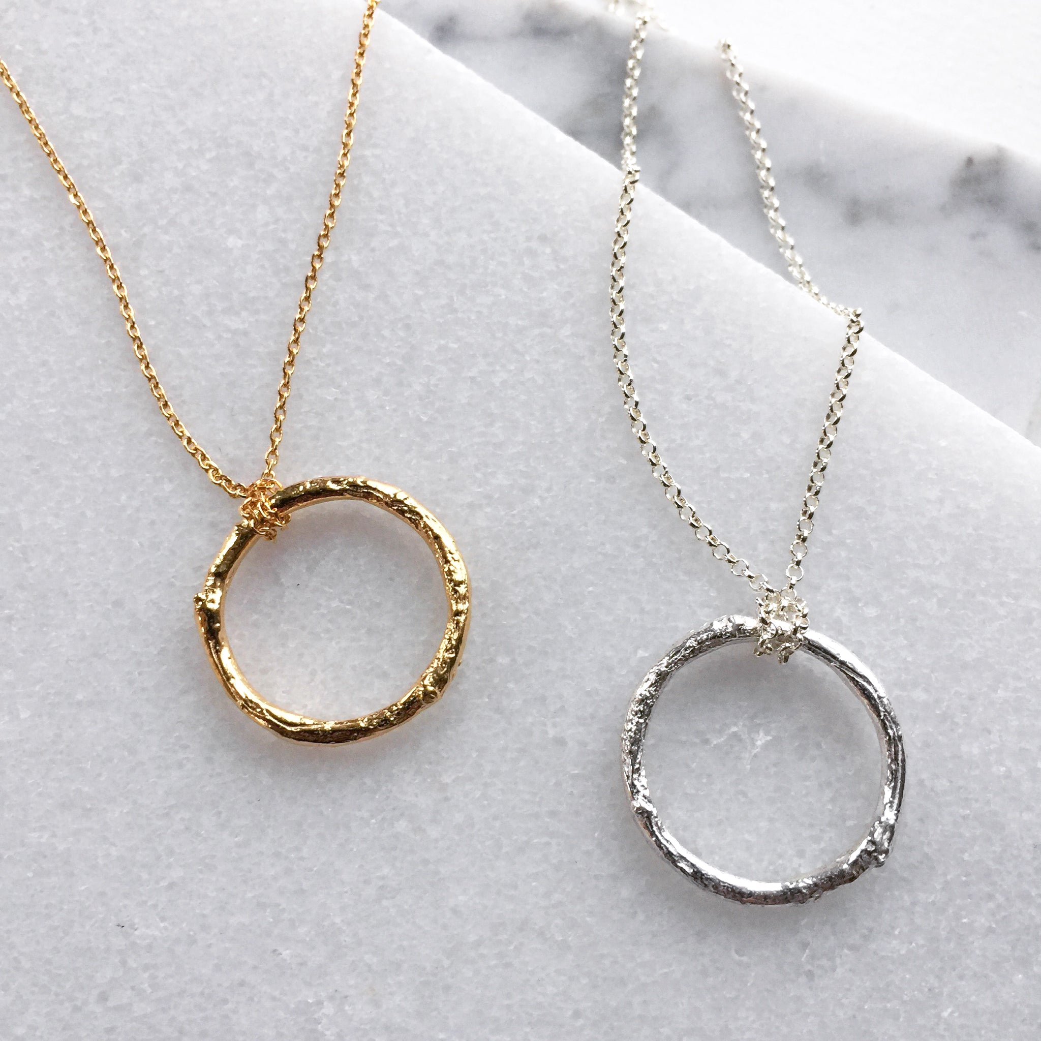 Circle necklace with chain through outlet it